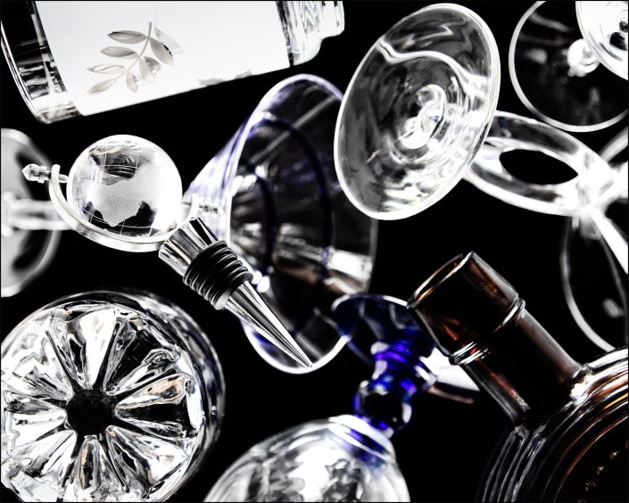 Twelfth abstract composition from the "An Abyss of Glass" project, a fourteen-image series featuring various glass objects, intricate dynamic highlights and shadows, arranged to create a sense of depth, tension, and visual illusion.