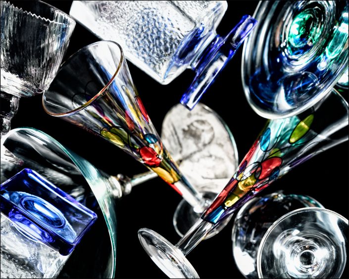 Second abstract composition from the "An Abyss of Glass" project, a fourteen-image series featuring various glass objects, intricate dynamic highlights and shadows, arranged to create a sense of depth, tension, and visual illusion.