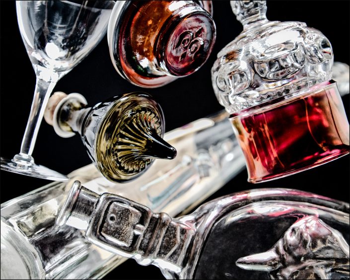 Eighth abstract composition from the "An Abyss of Glass" project, a fourteen-image series featuring various glass objects, intricate dynamic highlights and shadows, arranged to create a sense of depth, tension, and visual illusion.
