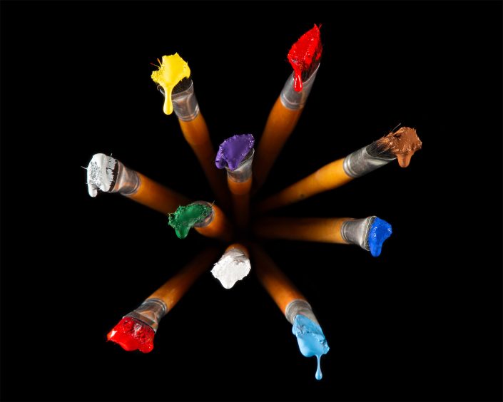 Features a composition that plays with gravity and perspective, suspended paintbrushes and vivid droplets create an optical illusion of reversed gravity against a stark black backdrop. It challenges viewers to reconsider their perceptions and appreciate the beauty in shifting viewpoints.
