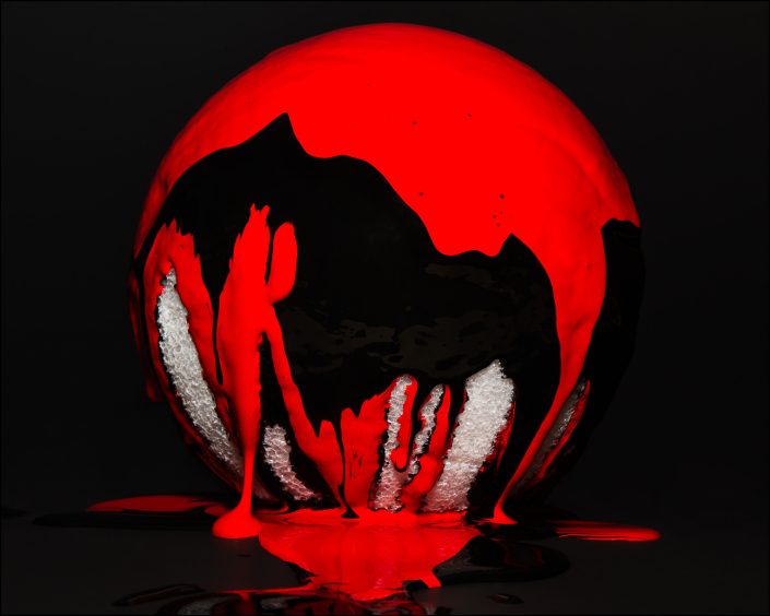Styrofoam ball with cascading paint, creating a dynamic contrast of color, texture, and depth, symbolizing the passage of time and transformation.
