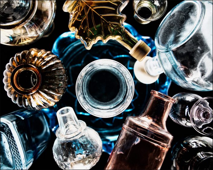 Thirteenth abstract composition from the "An Abyss of Glass" project, a fourteen-image series featuring various glass objects, intricate dynamic highlights and shadows, arranged to create a sense of depth, tension, and visual illusion.