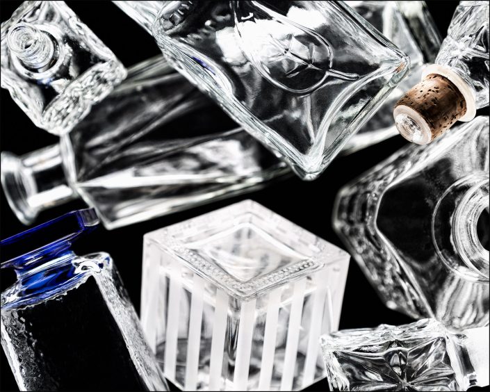 Fourth abstract composition from the "An Abyss of Glass" project, a fourteen-image series featuring various glass objects, intricate dynamic highlights and shadows, arranged to create a sense of depth, tension, and visual illusion.