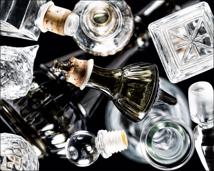 Ninth abstract composition from the "An Abyss of Glass" project, a fourteen-image series featuring various glass objects, intricate dynamic highlights and shadows, arranged to create a sense of depth, tension, and visual illusion.